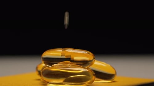 Fish oil flows down the gelatin capsules omega 3 fish oil pills