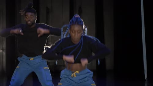 Dancers perform a hip-hop dance routine in studio