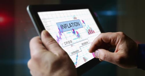 Inflation and recession crisis charts graphs on touchscreen pad display