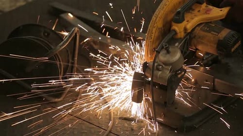 Novosibirsk, Russia - April 10, 2014: Builder Work Sawing Metal Pipe In