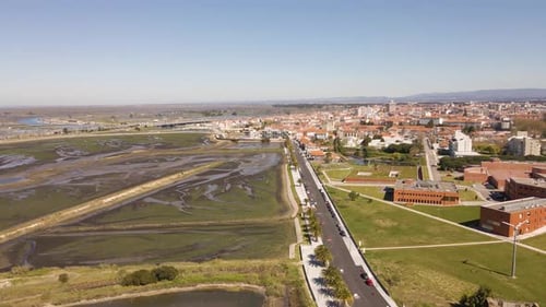 4K aerial view of Aveiro city on the left side of the street and the saline’s in the right side, 6of