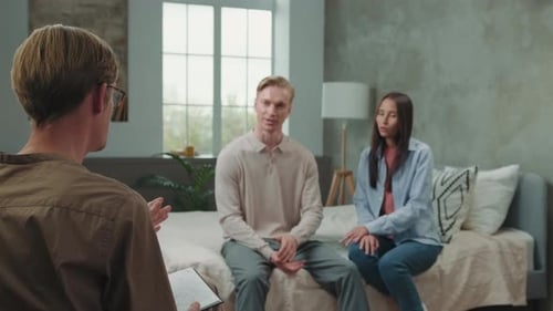 Multiracial Couple Quarreling at a Psychologist Appointment