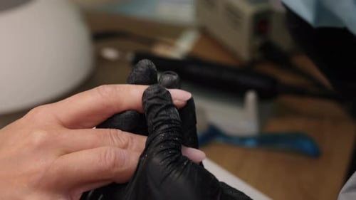 Filing Fingernails in a Nail Salon Close Up