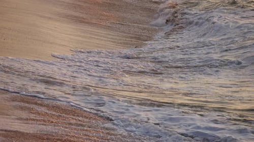 Sea Waves on Sunset Ocean Beach with the Sun Capture the Beauty of a Tranquil Golden Hour Ocean Wave