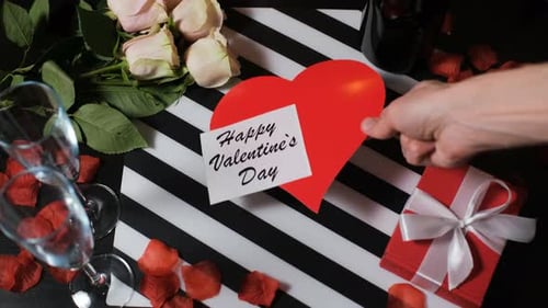 Happy Valentines Day message with champagne and roses