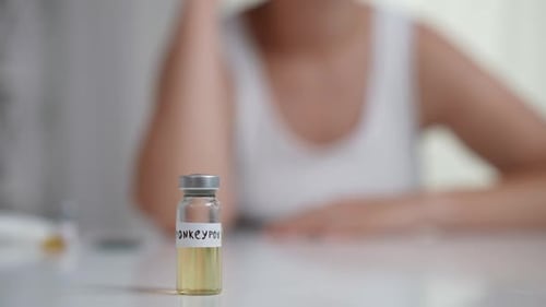 Vial Labeled Monkeypox Sits on Table