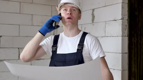 Portrait of an Architectbuilder Studying the Layout Plan of the Premises