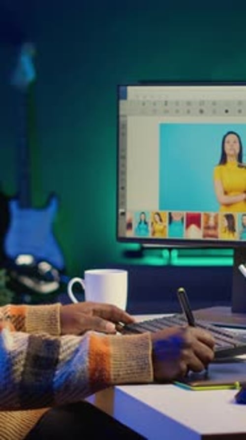 Young Adult Editing Photos at Night