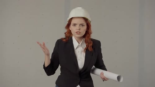 Woman Architect Gets Angry Emotionally Says Portrait of a Woman in a Protective Helmet and with
