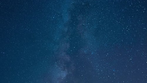 Time lapse of a starry night sky clouds