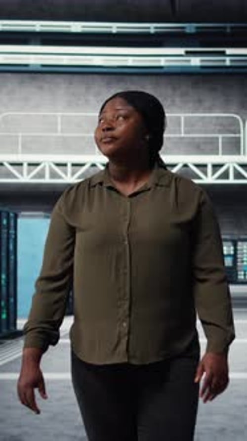 Vertical Video Portrait of Smiling Admin Walking in Data Center Overseeing IT Infrastructure