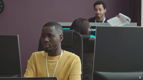 Thoughtful African American Programmer Working in Office