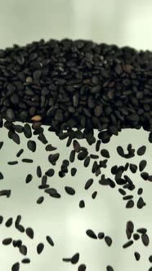 Falling Sesame Seeds From a Spoon