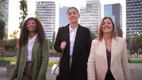 Three Confident Women Walking in Urban Setting