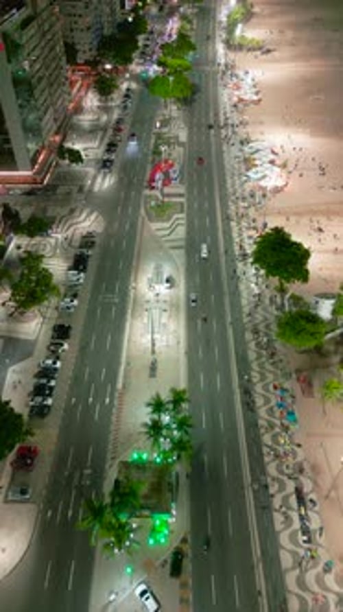 Busy Night View of Copacabana Beach Rio De Janeiro Featuring a Welllit Boulevard with Traffic and