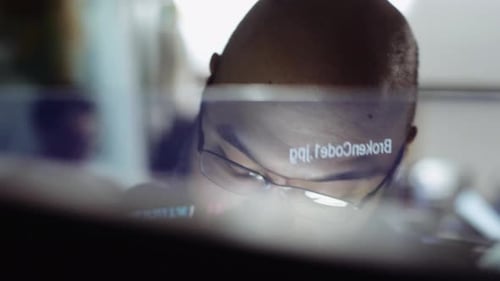 Close Up Computer Code Over Male Hacker in Eyeglasses 3539 Years