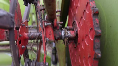 Close Up View Of Mechanical Gear Of A Combine Harvester. rack focus