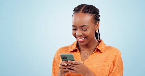 Woman, laugh and typing with smartphone in studio, scroll social media and reading funny