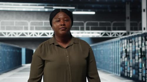 Portrait of Smiling Data Center Admin Conducting Security Audit