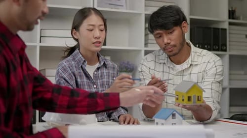 Hands working brainstorming and measuring for cost estimating on architectural and engineering.