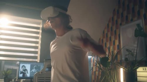 Young Adult Dancing with VR Headset Indoors