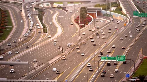 Cars Driving on Busy Hectic Urban City Road at Rush Hour Traffic