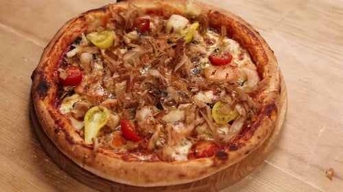 the chef prepares pizza in the restaurant