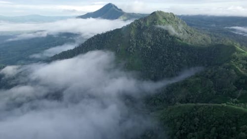 Aerial Drone Footage of Misty Mountain Peaks in the Morning
