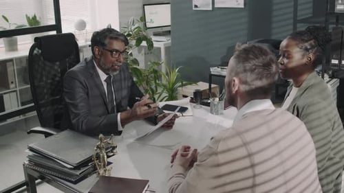 Business Meeting with Clients in Modern Office