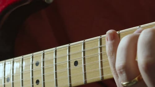 Guitarist Hand Moving Up and Down Fretboard of Stratocaster Guitar Playing Various Chords 4K