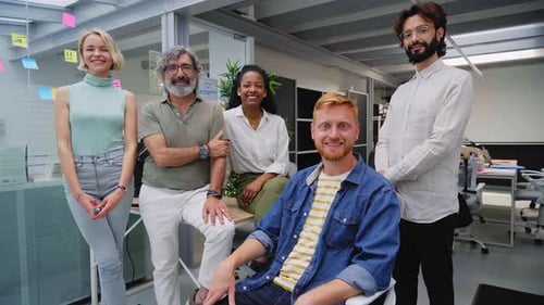 Diverse Business Team Poses in Modern Office