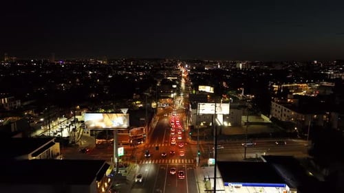 Forwards Fly Above Trunk Street in Night City Vehicles Driving on Thoroughfare and Passing