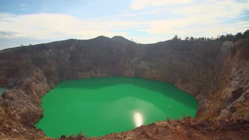 A volcanic crater Kelimutu lakes with green water