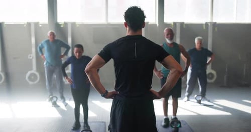 Fitness, workout and personal trainer with senior people for training, exercise and warm up in gym