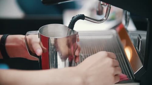 Barista Wipes Off a Branch Pipe From the Milk Coffee