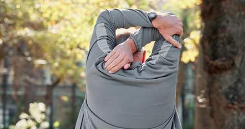 Old man, nature and stretching arms for warm up, runner and training in park for fitness in routine