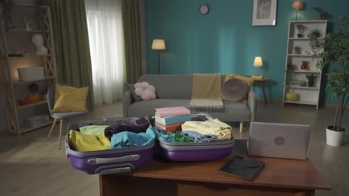 Open Suitcase with Clothes Ready for Travel