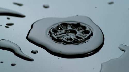 Water Drip Into Puddle Closeup, , on Phantom Flex