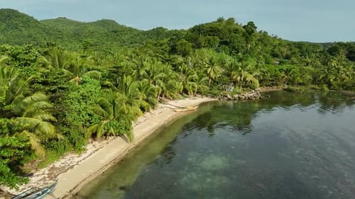 Philippine Island Paradise: Secluded Beach with Fishing Boats and Lush Coastline