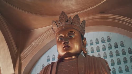 Circle pan close up of Chinese god in Kek Lok Si, Malaysia, daylight