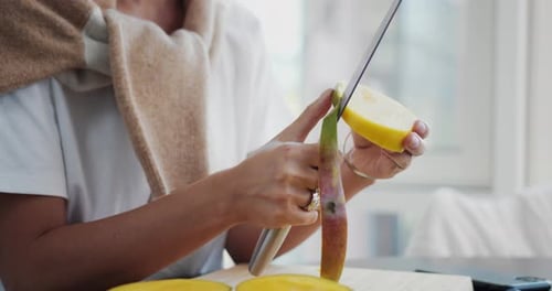 Close Up Of Hands Cutting A Ripe Mango Uhd