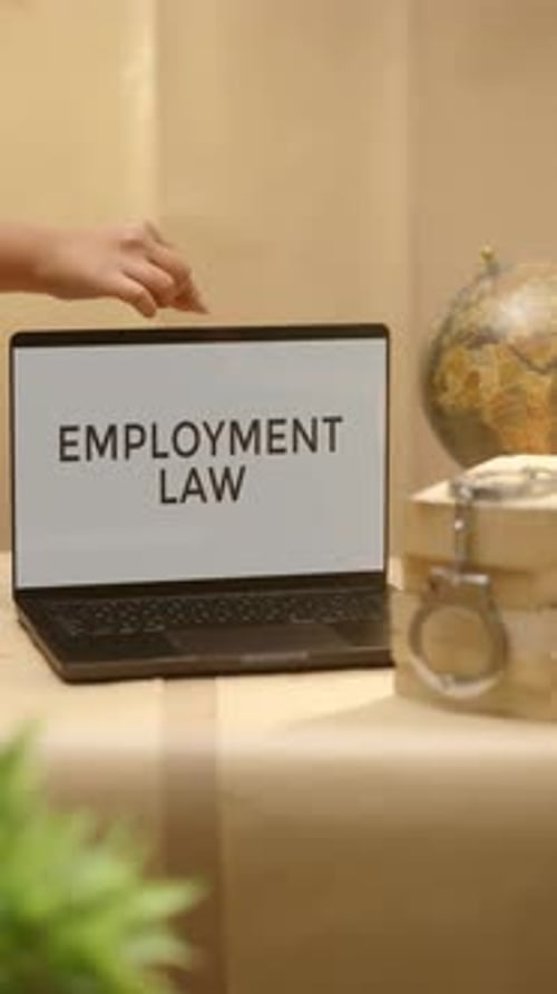 VERTICAL VIDEO OF EMPLOYMENT LAW DISPLAYED IN LEGAL LAPTOP SCREEN