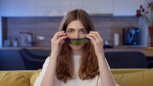 Auburn Haired Young Adult with Futuristic Glasses