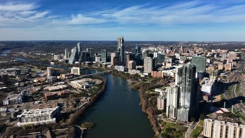 Downtown Austin and the Colorado river, fall in sunny US - aerial, slow, approach