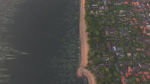 Aerial view of beach at sunrise overlooking Indian Ocean, Bali.