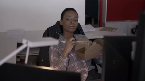 Woman Eating Lunch in Office Adult
