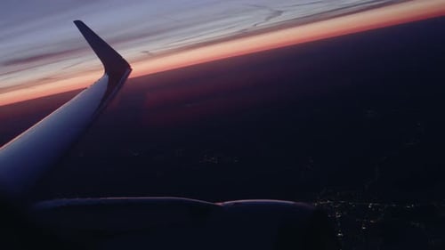 Airplane flying over city