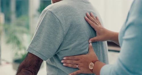 Adult Receiving a Back Massage Indoors