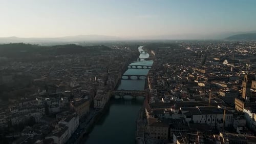 Aerial view of historic cityscape and river, Italy.
