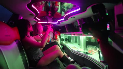 Young women enjoying a fun limousine party night out